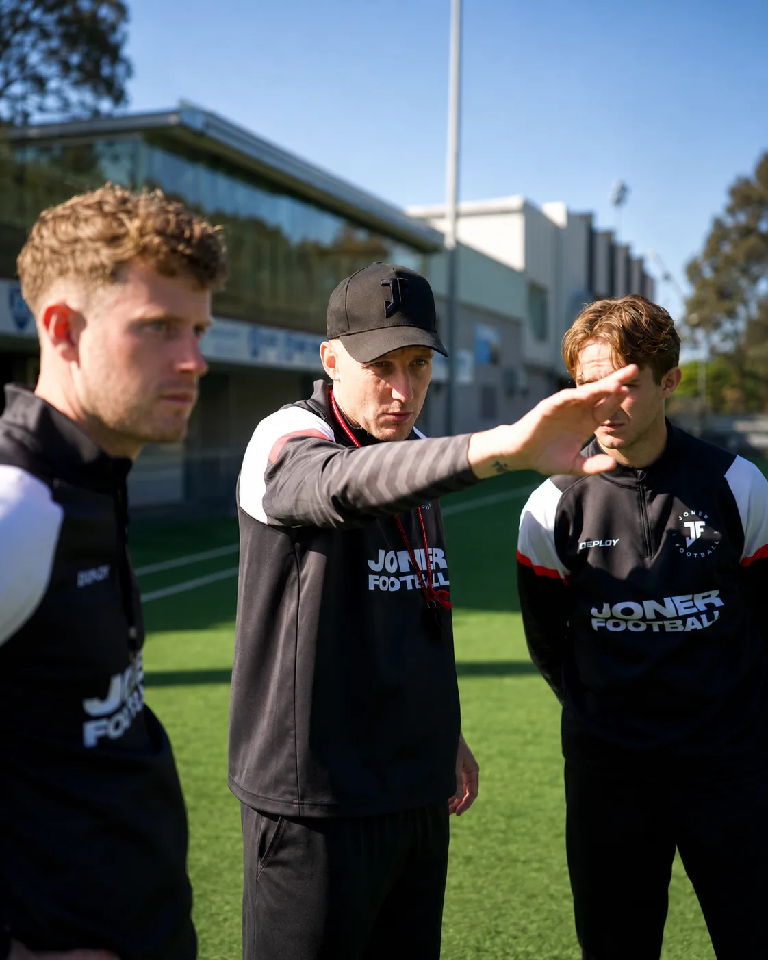Lee Jones coaching players on the pitch