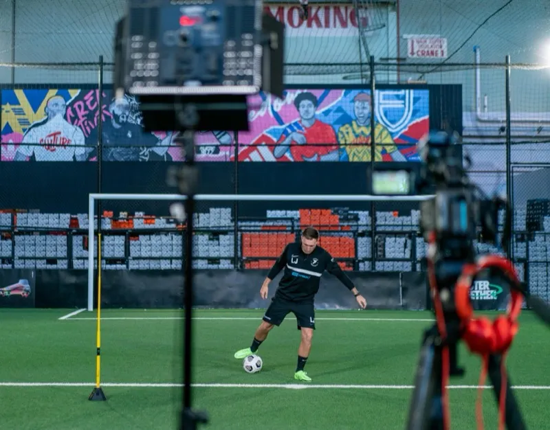 Young player training at Joner Football indoor facility