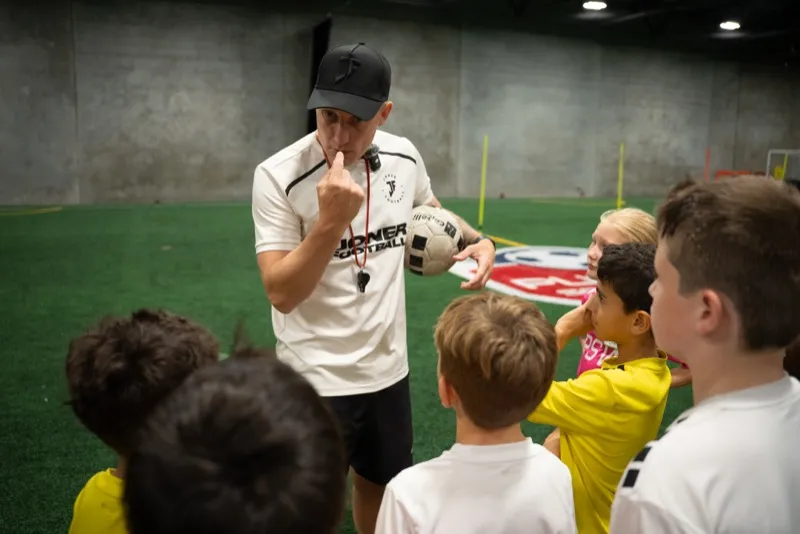 Lee Jones coaching a professional football player at Joner Football